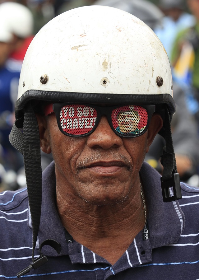 A motorcyclist supporting Venezuela's President Nicolas Maduro takes part in a rally for peace in Caracas