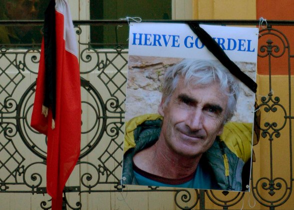 A portrait of mountain guide of Frenchman Gourdel hangs outside the town hall in Saint-Martin-Vesubie