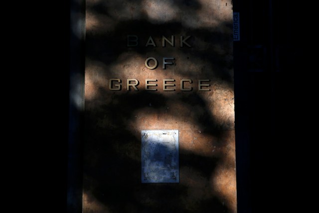 The sun lights the logo of the Bank of Greece on the headquarters buildling in central Athens