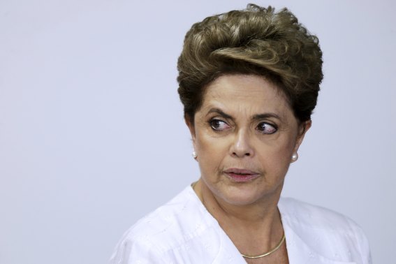 Brazil's President Dilma Rousseff looks on during signing of federal land transfer agreement for the government of the state of Amapa at Planalto Palace in Brasilia, Brazil, April 15, 2016. Rousseff lost a decisive impeachment vote in the lower house of Congress on Sunday and appeared almost certain to be forced from office in a move that would end 13 years of leftist Workers' Party rule.   REUTERS/Ueslei Marcelino      TPX IMAGES OF THE DAY