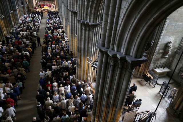 People attend a funeral service to slain French parish priest Father Jacques Hamel at the Cathedral in Rouen, France, August 2, 2016. Father Jacques Hamel was killed last week in an attack on a church at Saint-Etienne-du-Rouvray near Rouen that was carried out by assailants linked to Islamic State.   REUTERS/Charly Triballeau/Pool