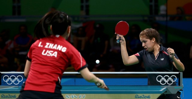 2016 Rio Olympics - Table Tennis - Women's Singles Preliminary Round - Riocentro - Pavilion 3 - Rio de Janeiro, Brazil - 06/08/2016. Gremlis Arvelo (VEN) of Venezuela competes against Lily Zhang (USA) of USA. REUTERS/Alkis Konstantinidis FOR EDITORIAL USE ONLY. NOT FOR SALE FOR MARKETING OR ADVERTISING CAMPAIGNS.