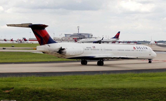 Delta airplanes line up on the taxi way after Delta Air Lines' computer systems crashed on Monday, grounding flights around the globe, at Hartsfield Jackson Atlanta International Airport in Atlanta, Georgia, U.S. August 8, 2016.  REUTERS/Tami Chappell