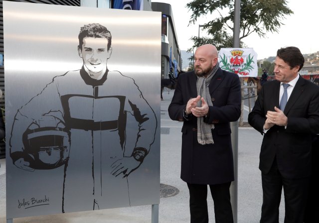 Philippe Bianchi (L), the father of Jules Bianchi Formula One driver who died on July 17, 2015 after an accident during the Japanese Grand Prix Formula 1 race on October 5, 2014, poses with Christian Estrosi (R), President of the Provence Alpes Cote d'Azur (PACA) region, near a plaque with the drawing of his son during its unveiling in Nice, France, January 23, 2017. REUTERS/Eric Gaillard