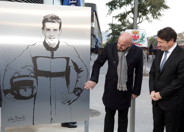 Philippe Bianchi (L), the father of Jules Bianchi Formula One driver who died on July 17, 2015 after an accident during the Japanese Grand Prix Formula 1 race on October 5, 2014, poses with Christian Estrosi (R), President of the Provence Alpes Cote d'Azur (PACA) region, near a plaque with the drawing of his son during its unveiling in Nice, France, January 23, 2017. REUTERS/Eric Gaillard