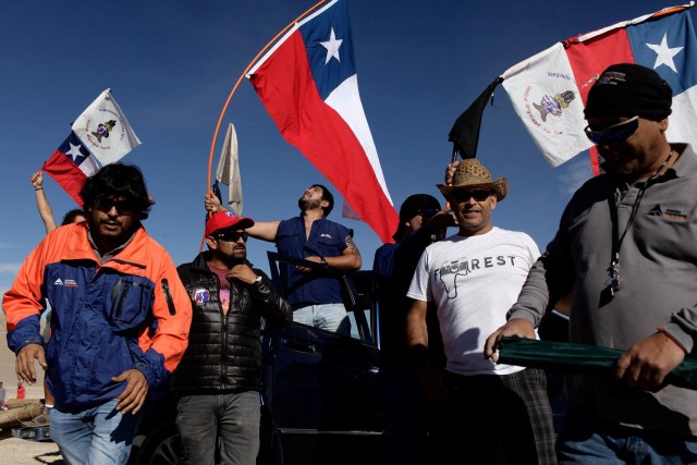 Workers from Escondida, the world's biggest copper mine, gather outside the company gates during a strike, in Antofagasta, Chile February 9, 2017. REUTERS/Juan Ricardo EDITORIAL USE ONLY. NO RESALES. NO ARCHIVE