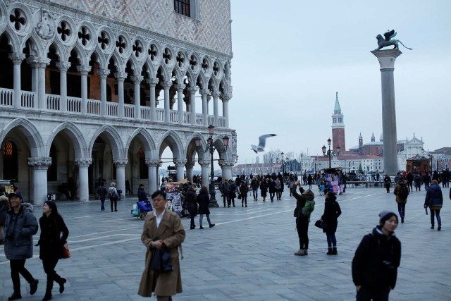 People walk in Saint Mark's square in Venice, Italy February 10, 2017. REUTERS/Tony Gentile