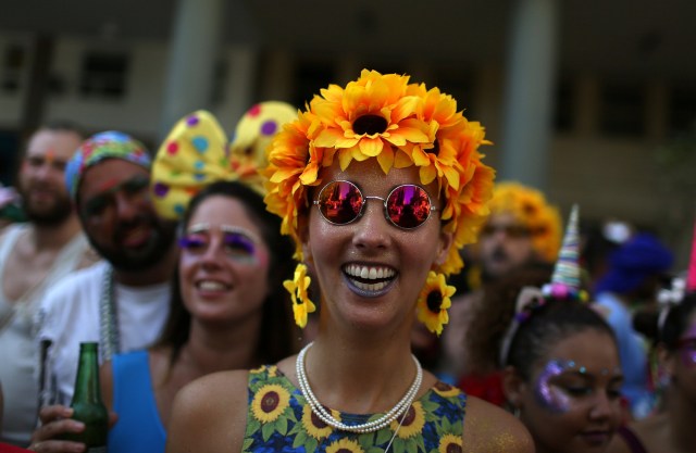 Revellers take part in the annual block party Cordao de Boitata during pre-carnival festivities in Rio Janeiro, Brazil February 19, 2017. REUTERS/Pilar Olivares
