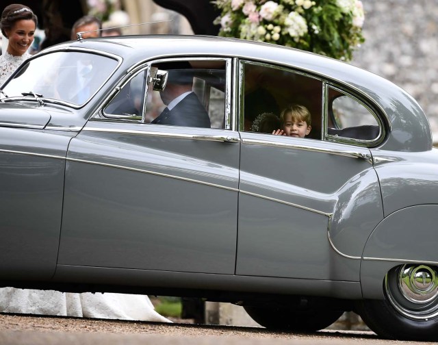 Britain's Prince George waves as he leaves in a car after attending the wedding of his aunt, Pippa Middleton, to James Matthews at St Mark's Church in Englefield, Britain May 20, 2017. Pippa Middleton is the sister of Catherine, Duchess of Cambridge.  REUTERS/Justin Tallis/Pool