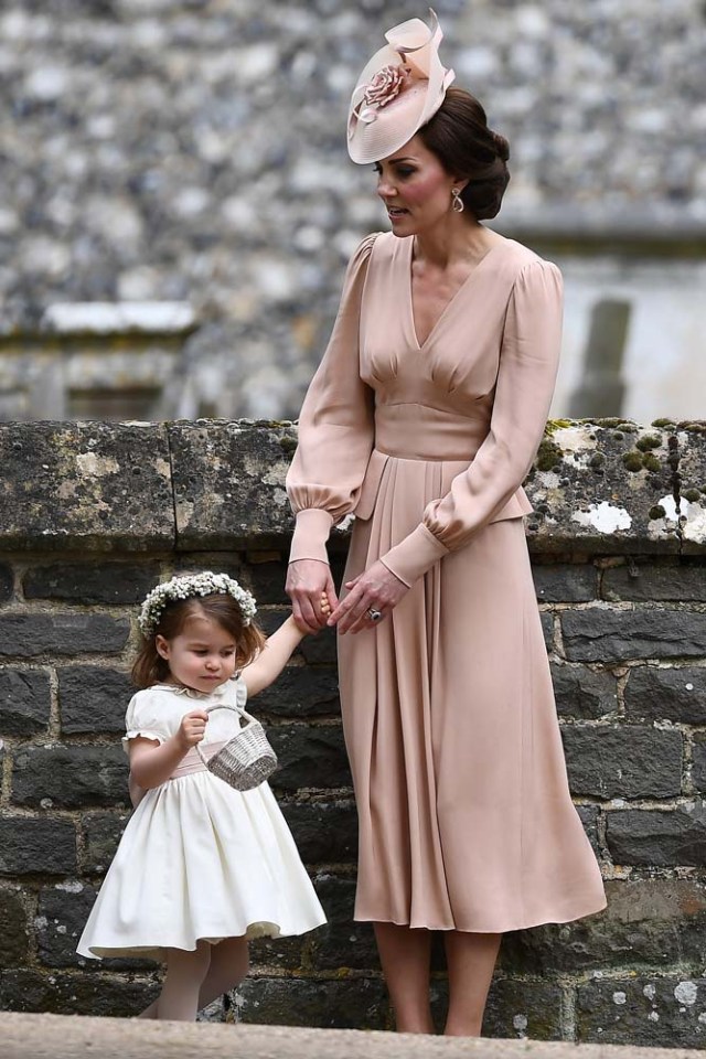 Britain's Catherine, Duchess of Cambridge stands with her daughter Princess Charlotte, a bridesmaid, following the wedding of her sister Pippa Middleton to James Matthews at St Mark's Church in Englefield, west of London, on May 20, 2017.    REUTERS/Justin Tallis/Pool