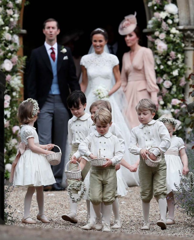 Britain's Prince George stands with other flower boys and girls, and his mother Catherine, Duchess of Cambridge after the wedding of Pippa Middleton and James Matthews at St Mark's Church in Englefield, Britain on May 20, 2017.    REUTERS/Kirsty Wigglesworth/Pool