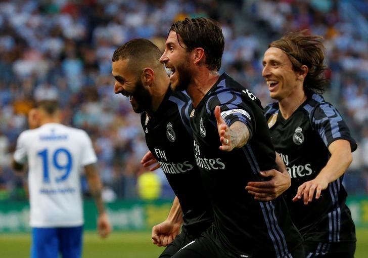 El Real Madrid gana en Málaga y es campeón de la Liga española