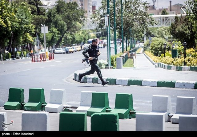 A member of Iranian forces runs during an attack on the Iranian parliament in central Tehran, Iran, June 7, 2017. Tasnim News Agency/Handout via REUTERS ATTENTION EDITORS - THIS PICTURE WAS PROVIDED BY A THIRD PARTY. FOR EDITORIAL USE ONLY. NO RESALES. NO ARCHIVE.