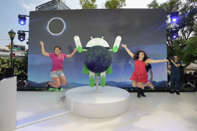 NEW YORK, NY - AUGUST 21: Guests pose for a photo as Google and Oreo reveal Android OREO during the solar eclipse at the 14th street park on August 21, 2017 in New York City.   Jason Kempin/Getty Images for Oreo/AFP