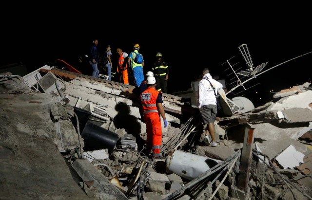Rescue workers check a collapsed house after an earthquake hits the island of Ischia, off the coast of Naples, Italy August 22, 2017. REUTERS/Ciro De Luca