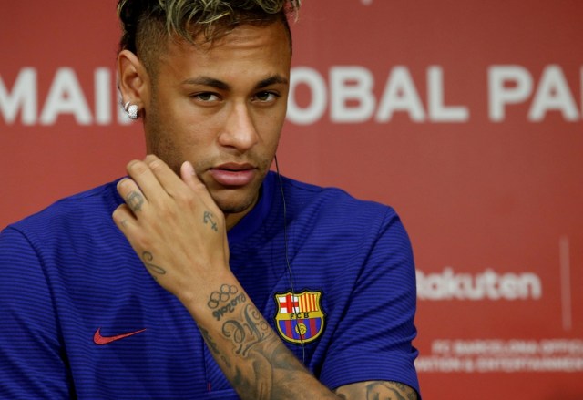 FILE PHOTO: FC Barcelona player Neymar attends a news conference in Tokyo, Japan July 13, 2017.  REUTERS/Kim Kyung-Hoon/File Photo