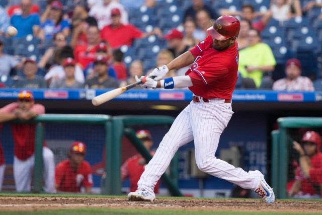 Aug 22, 2017; Philadelphia, PA, USA; Philadelphia Phillies second baseman Andres Blanco (4) hits a two RBI home run during the ninth inning against the Miami Marlins at Citizens Bank Park. Mandatory Credit: Bill Streicher-USA TODAY Sports