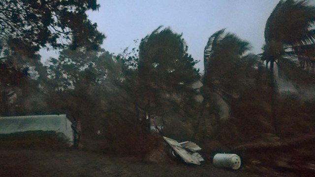 A picture taken on September 19, 2017 shows the powerful winds and rains of hurricane Maria battering the city of Petit-Bourg on the French overseas Caribbean island of Guadeloupe. Hurricane Maria strengthened into a "potentially catastrophic" Category Five storm as it barrelled into eastern Caribbean islands still reeling from Irma, forcing residents to evacuate in powerful winds and lashing rain. / AFP PHOTO / Cedrik-Isham Calvados