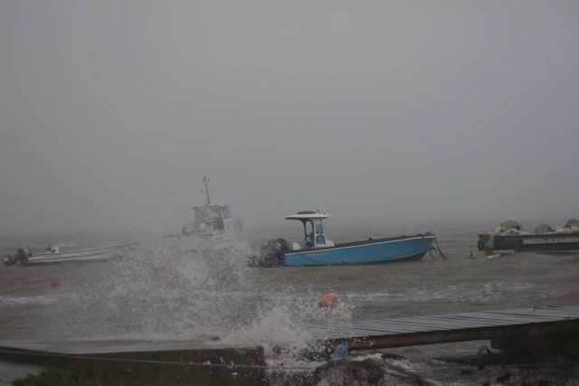 Boats remain anchored in a wharf as Hurricane Maria approaches in Guadeloupe island, France, September 18, 2017. REUTERS/Andres Martinez Casares