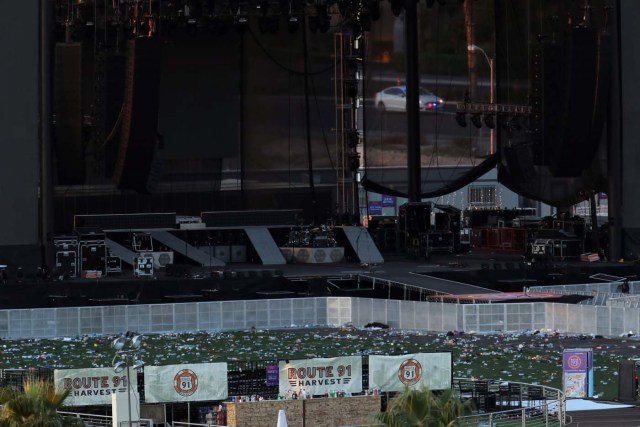 A police car patrols behind the stage of the Route 91 Harvest Country Music Festival on the Las Vegas Strip in Las Vegas, Nevada, U.S., October 3, 2017. REUTERS/Mike Blake