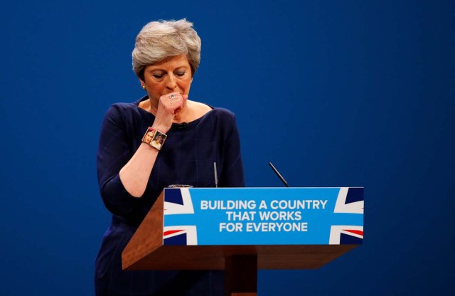 Britain's Prime Minister Theresa May coughs as she addresses the Conservative Party conference in Manchester, October 4, 2017. REUTERS/Phil Noble