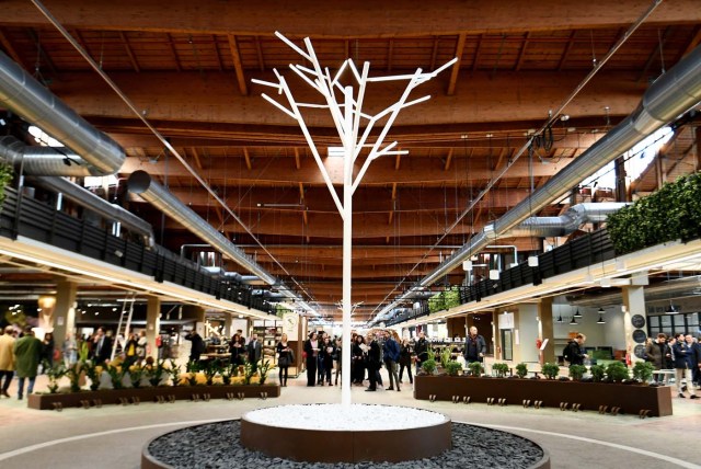 Visitors walk during a press tour at FICO Eataly World agri-food park in Bologna on November 9, 2017. FICO Eataly World, said to be the world's biggest agri-food park, will open to the public on November 15, 2017. The free entry park, widely described as the Disney World of Italian food, is ten hectares big and will enshrine all the Italian food biodiversity. / AFP PHOTO / Vincenzo PINTO