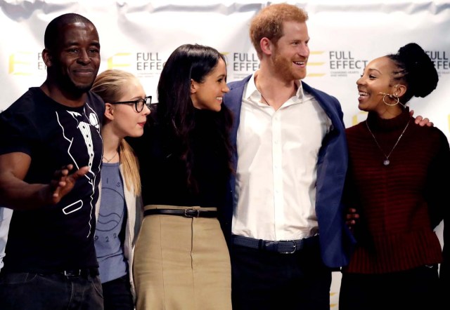 Britain's Prince Harry and his fiancee Meghan Markle pose for a photograph with the cast of a hip hop opera performed by young people involved in the Full Effect programme at the Nottingham Academy school in Nottingham, Britain, December 1, 2017. REUTERS/Matt Dunham/Pool