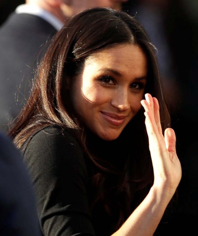Meghan Markle, waves after visiting the Nottingham Academy school with her fiancee Britain's Prince Harry in Nottingham, Britain, December 1, 2017. REUTERS/Matt Dunham/Pool