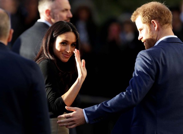 Meghan Markle, accompanied by her fiancee Britain's Prince Harry, visits the Nottingham Academy school in Nottingham, Britain, December 1, 2017. REUTERS/Matt Dunham/Pool