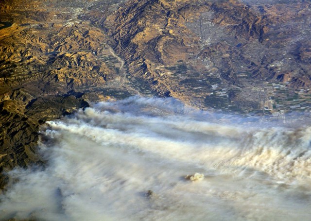 A photo taken from the International Space Station and moved on social media by astronaut Randy Bresnik shows smoke rising from wildfire burning in Southern California, U.S., December 6, 2017.  Courtesy @AstroKomrade/NASA/Handout via REUTERS   ATTENTION EDITORS - THIS IMAGE HAS BEEN SUPPLIED BY A THIRD PARTY.     TPX IMAGES OF THE DAY