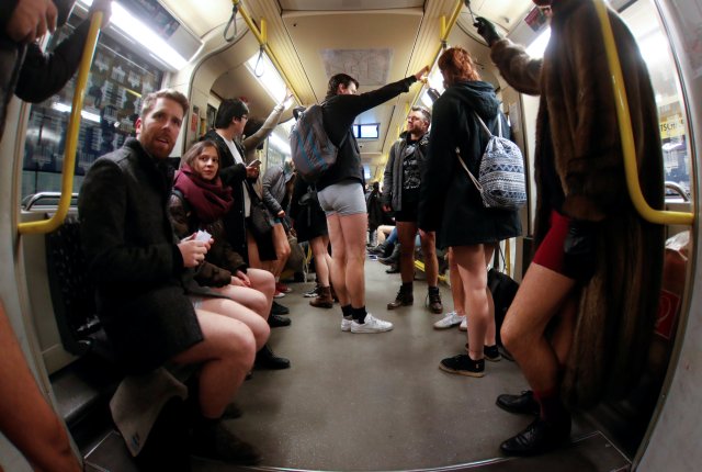 People take part in the annual flash mob "No Pants Subway Ride" in Berlin, Germany, January 7, 2018. Picture taken with a fish-eye lens. REUTERS/Hannibal Hanschke