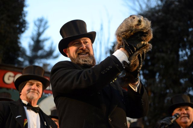 Groundhog co-handler A.J. Derume holds Punxsutawney Phil at Gobbler's Knob on the 132nd Groundhog Day in Punxsutawney, Pennsylvania, U.S. February 2, 2018. REUTERS/Alan Freed