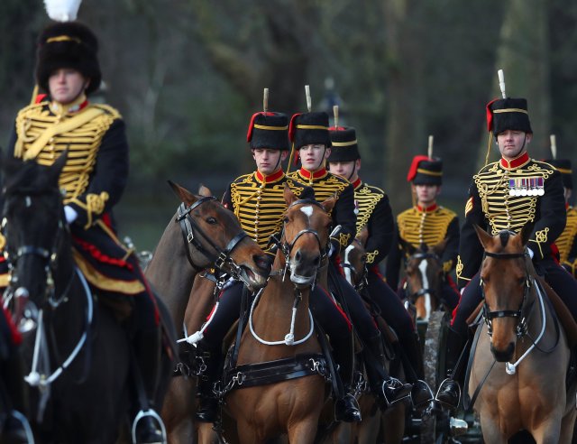 Members of the King’s Troop Royal Horse Artillery ride on their way to firing a 41 gun salute to mark the 66th anniversary of Britain's Queen Elizabeth's accession to the throne, in Green Park, London, February 6, 2018. REUTERS/Hannah McKay