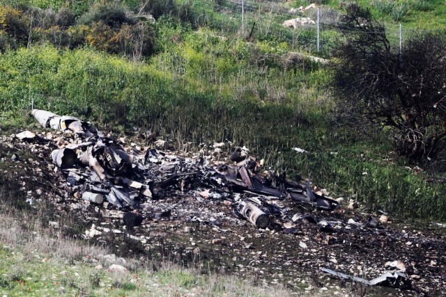 The remains of an F-16 Israeli war plane can be seen near the Israeli village of Harduf February 10, 2018. REUTERS/ Ronen Zvulun