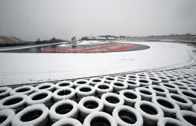 F1 Formula One - Formula One Test Session - Circuit de Barcelona-Catalunya, Montmelo, Spain - February 28, 2018 Race control check the track surrounded by snow before testing REUTERS/Albert Gea