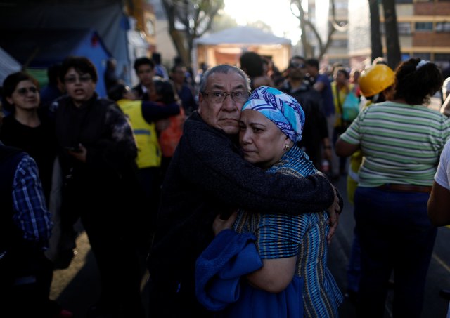 People wait along the street after a tremor was felt in Mexico City, Mexico February 16, 2018. REUTERS/Edgard Garrido