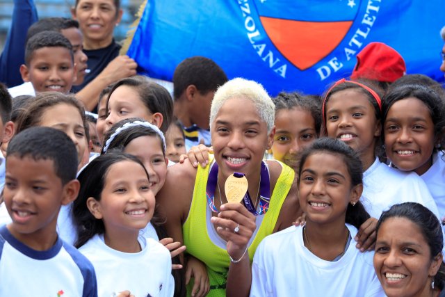 Venezuela's Yulimar Rojas, Women’s Triple Jump gold medallist in IAAF World Indoor Championships 2018, poses for a photo during a news conference in Caracas, Venezuela March 8, 2018. REUTERS/Marco Bello